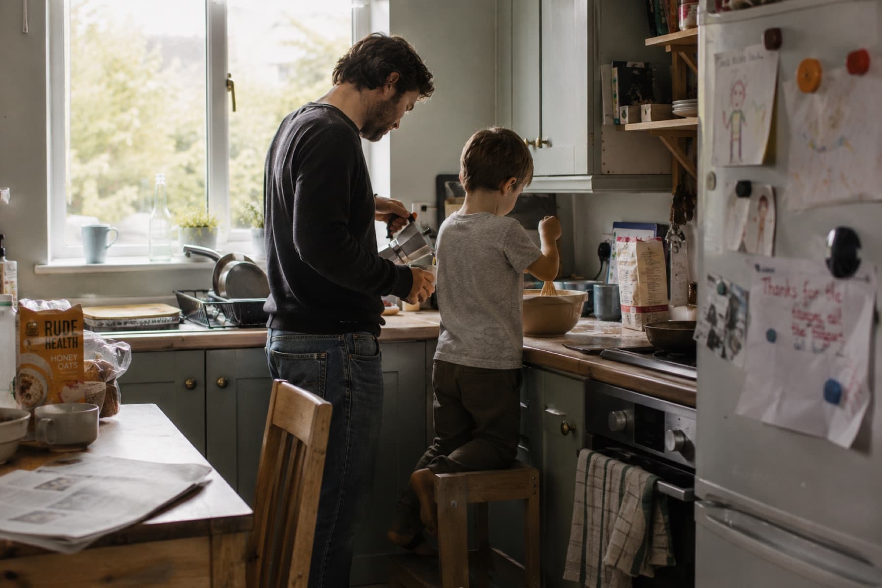 A father and son reconnecting while spending time in the kitchen